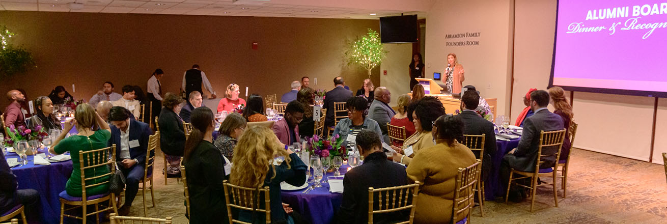 Alumni Board members and guests enjoy dinner on campus