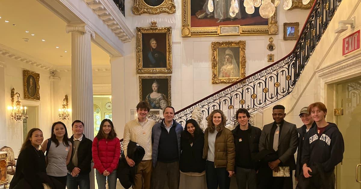 The tour group in the Hillwood's magnificent, portrait-lined front staircase.