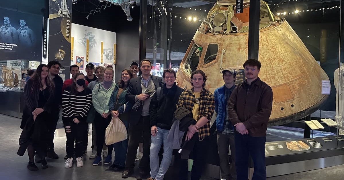 Class stands for photo in front of the actual Apollo 11 capsule.