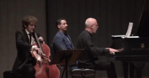 Feltsman playing piano accompanied by Ben Capps on cello.