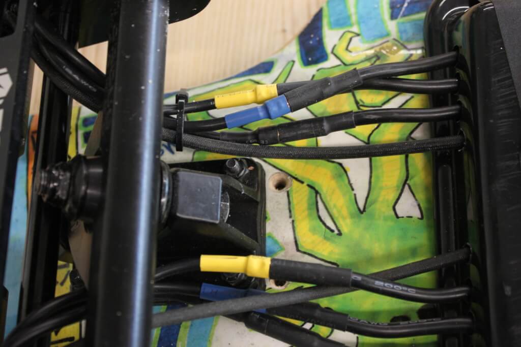 The wiring underneath Tomy's skateboard