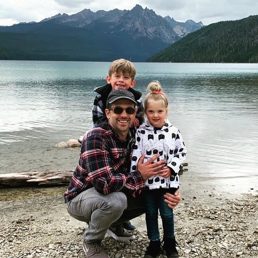 Jordan Prassinos and children at lake