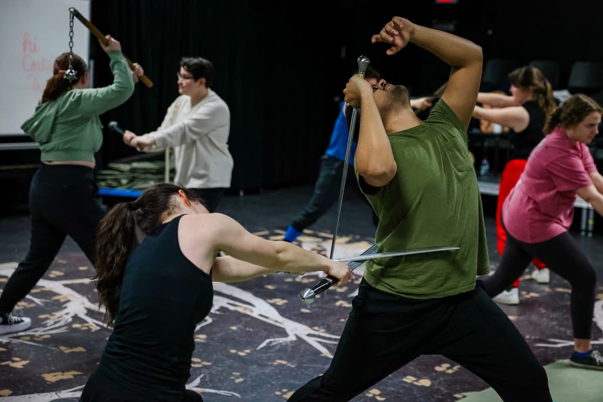 Student actors practice fight choreography