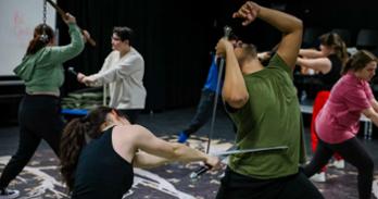 Student actors practice fight choreography