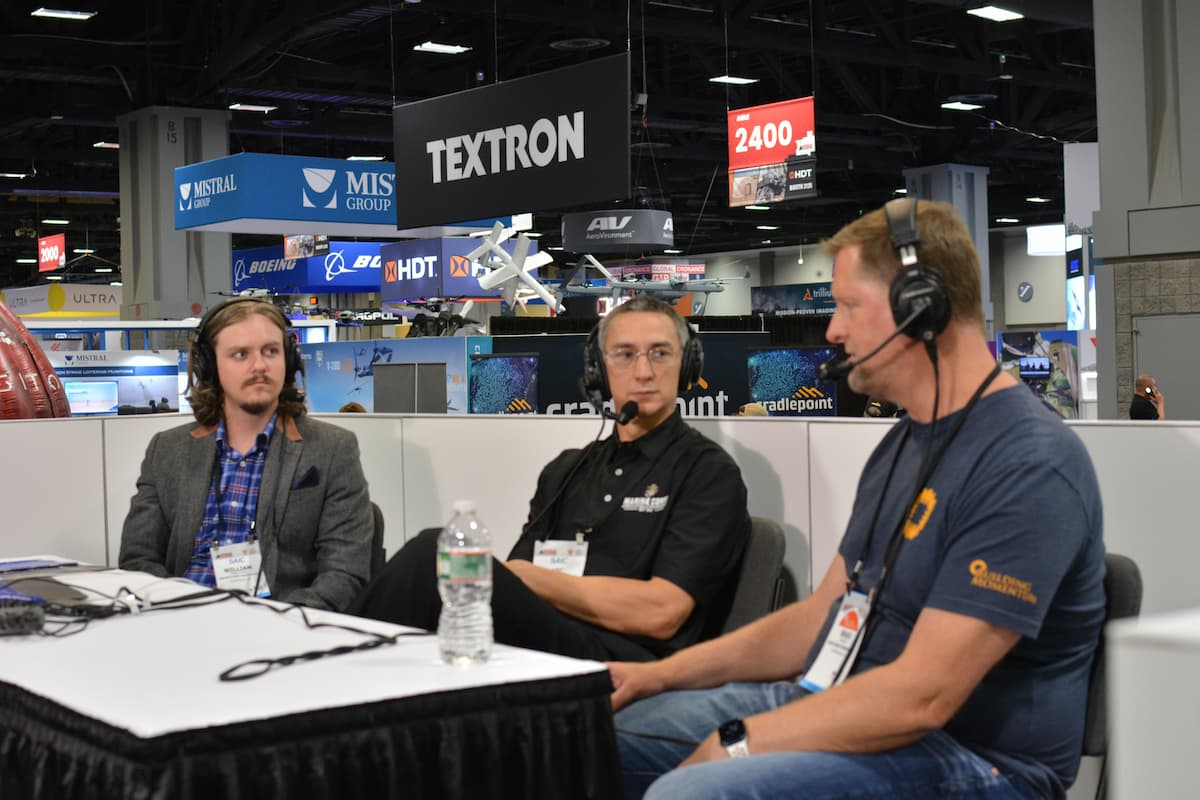 Vic Ruble (center) conducting an interview at the Modern Day Marine Expo