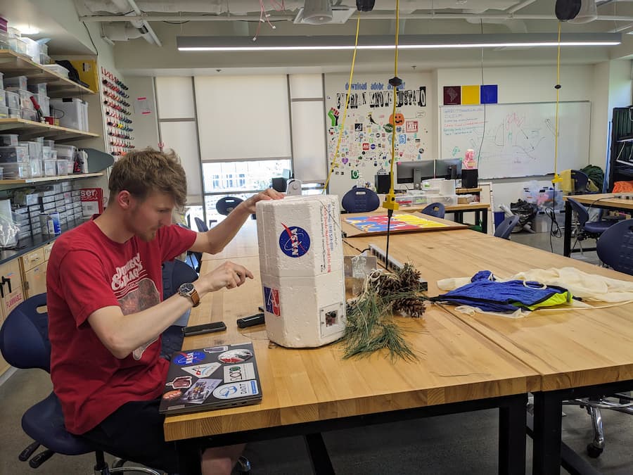 Caleb Dando-Haenisch opening the payload the next morning after its successful recovery. 