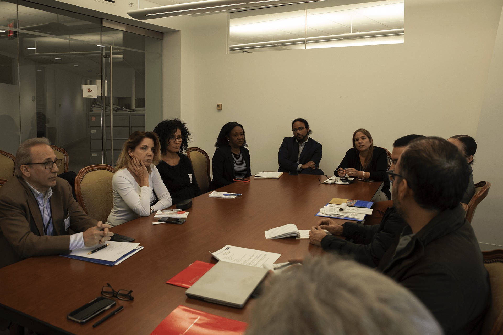 Researchers meet with personnel at the OAS.