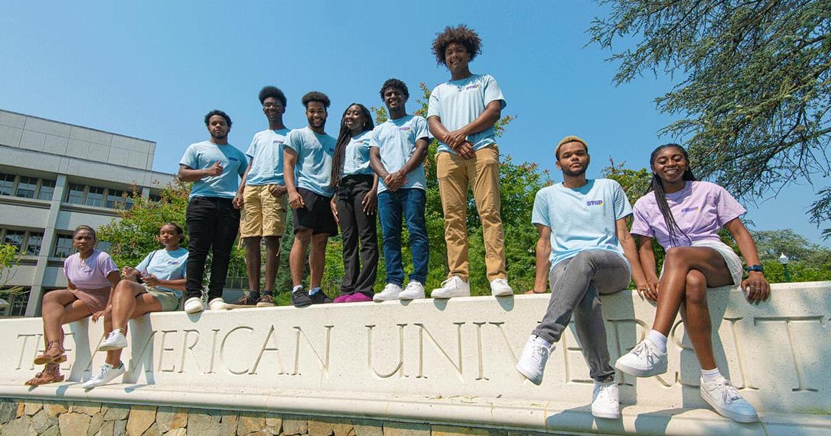 STEP students standing at AU gate