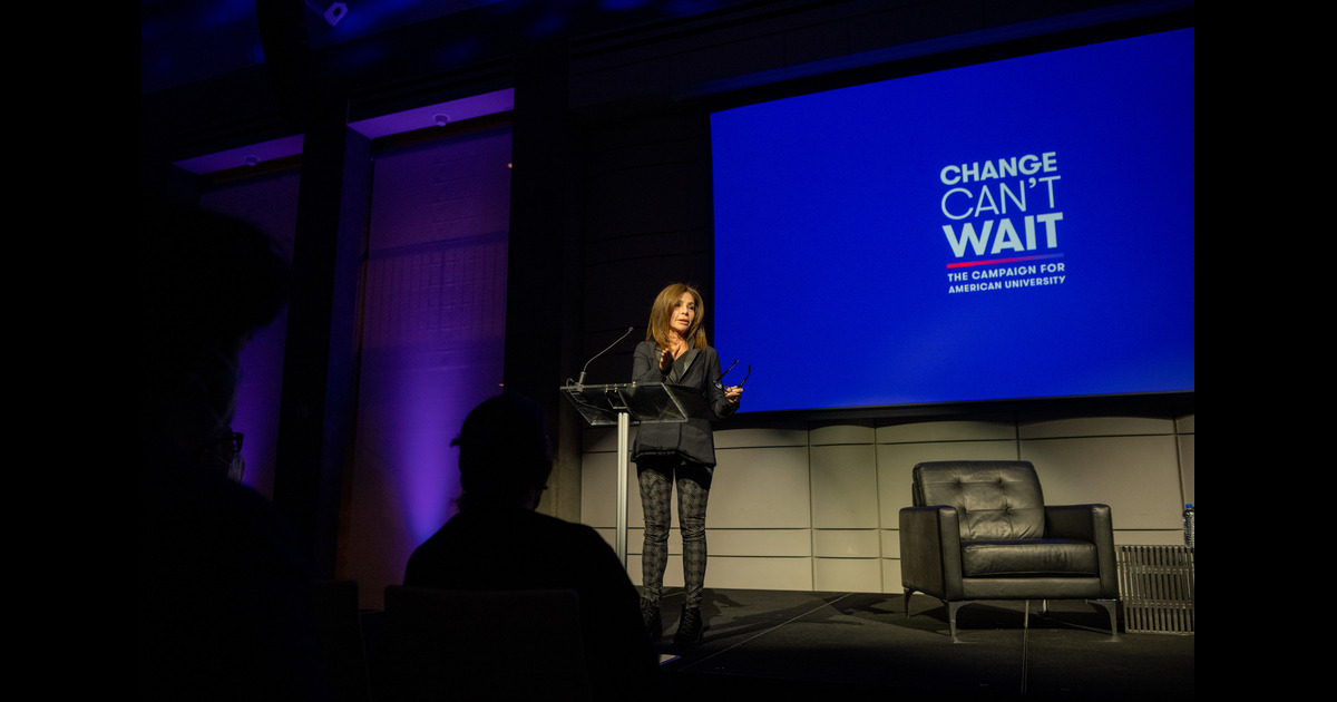 Jill Black, SOC/BA '83, delivers a speech at a podium at a Change Can't Wait event.