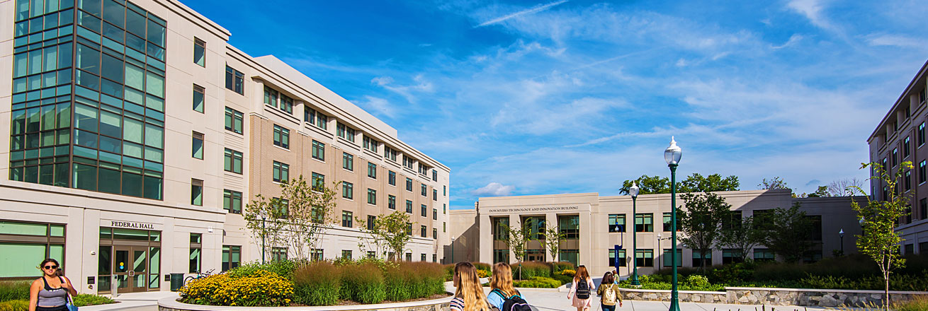 Students walking across the East Campus quad