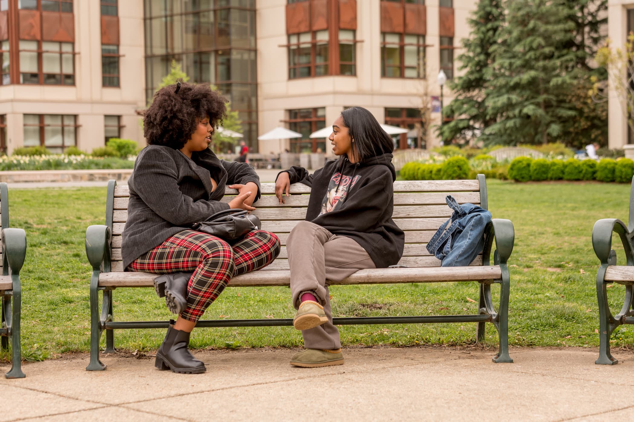 Students sitting on a bench outside