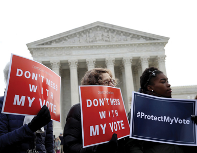 voting rights activists gather in front of the Supreme Court