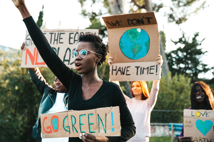 climate activist holding a sign