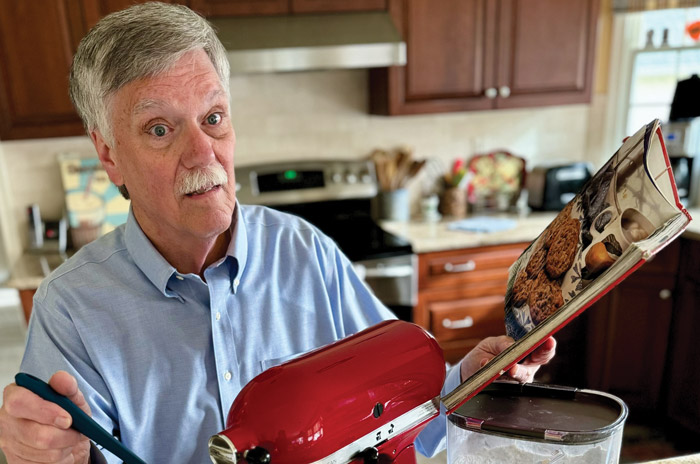 Ed Wasil in his kitchen with his baking supplies