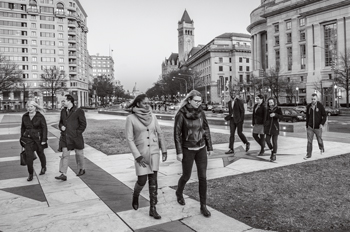 au alumni and students walk across Freedom Plaza