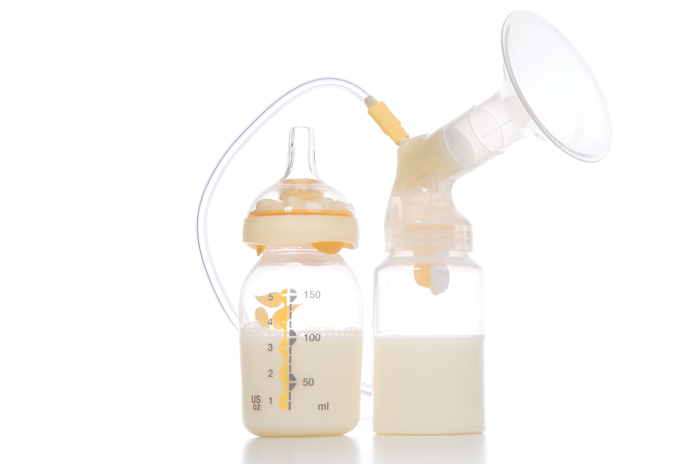 breast pump with milk in a bottle