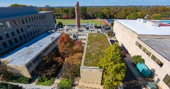 The two 100-foot smokestacks behind Asbury Hall are coming down over winter break.