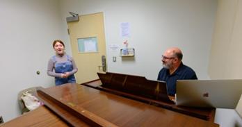 Austin Zielenbach, SPA/BA ’24, auditions for the national anthem as CAS professor Dan Abraham listens. Photo by Jeff Watts