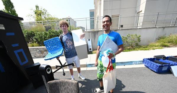 From left, roommates Alex Reardon, Kogod/BS '28, and Abdulla Abduganiev CAS/BS '28, take their finds back to Letts Hall. Photo by Jeff Watts. 