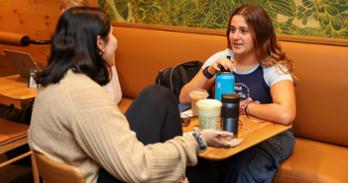 AU students sit in the Starbucks in Lydecker Tunnel. Photo by Ethan Kauffman, SOC/BA '26.