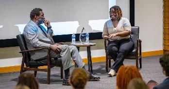 Julia Mouketo (R) interviews Doug Williams (L) for AU PRSSA's 'Icons of DC' award