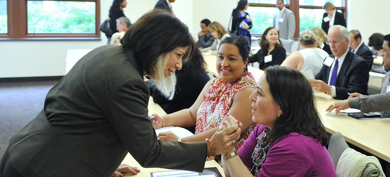 Ruth Zaplin talking with students in a classroom.