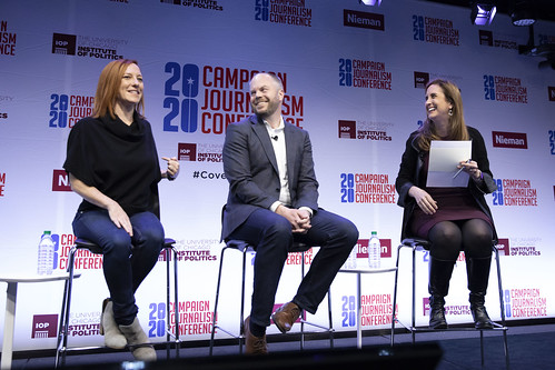 Betsy Fischer Martin and panelists smiling on stage