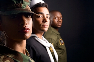 Three military veterans lined up looking toward the camera.