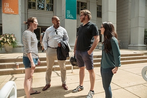 students and faculty outside Kerwin Hall