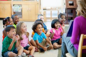 Teacher in front of young children