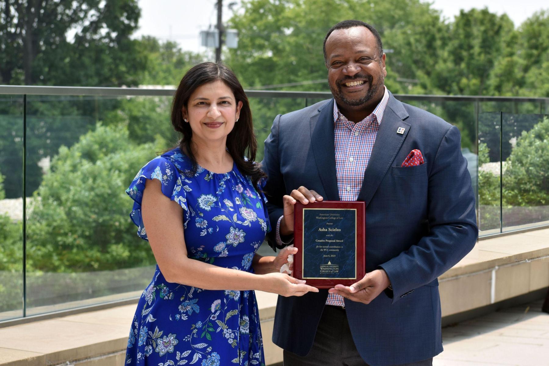  Asha Scielzo receiving the Creative Proposal Award from Dean Fairfax