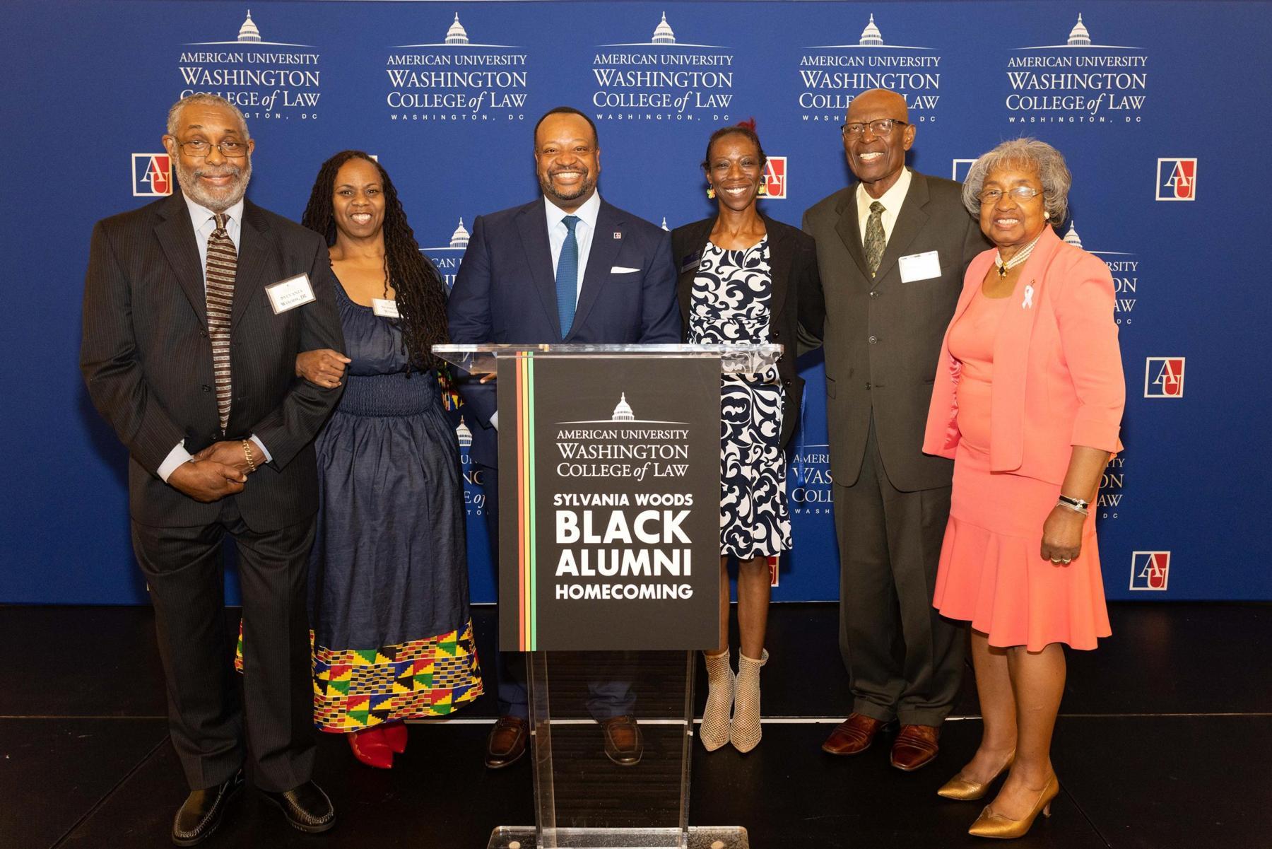 Dean Fairfax and staff member Denise Richards with members of the Sylvania Woods family. 